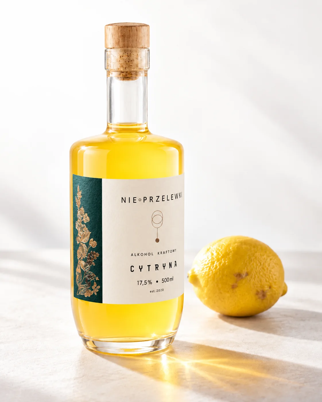 A 500 ml bottle of Lemon from the side, the colour of the liquid against the light