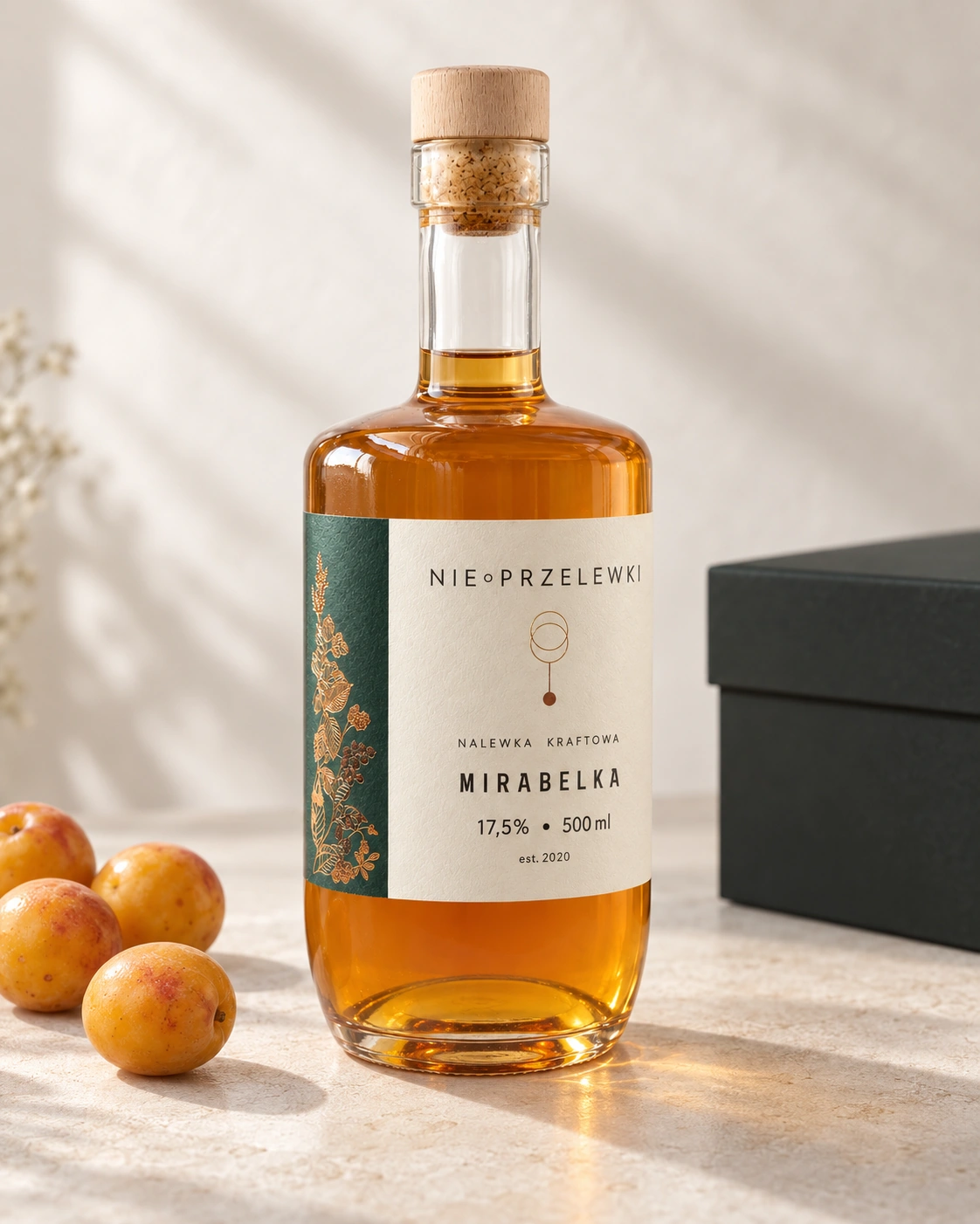 A 500 ml bottle of Mirabelle Plum from the side, the colour of the liquid against the light